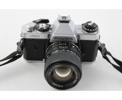 Fujica AX-1 SLR Film Camera w/ X-Fujinon 55mm F/1.6 DM Lens  The camera is WORKING and in a good condition Protective plastic