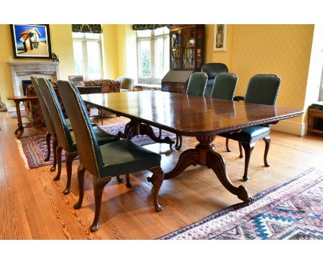A GOOD MAHOGANY DOUBLE PILLAR DINING TABLE with loose leaf, on two pillars with tripod curving legs with castors. 9ft 5ins lo