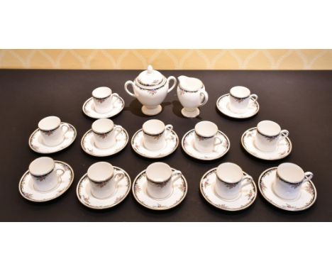 A SET OF TWELVE WEDGWOOD BONE CHINA CUPS AND SAUCERS, along with a sugar basin and milk jug (26).