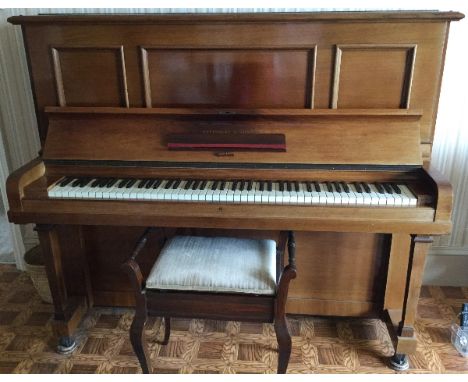 Steinway (c1928) A Model K upright piano in a mahogany case; together with a stool.