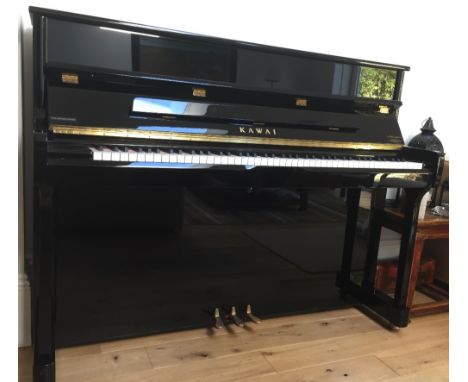 Kawai (c2008) A Model K-2 upright piano in a bright ebonised case; together with a black concert stool.  AMENDMENT Is togethe