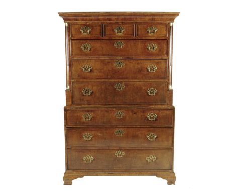 A George II walnut chest on chest, inlaid with boxwood stringing, with three short and three long drawers, flanked by stop fl