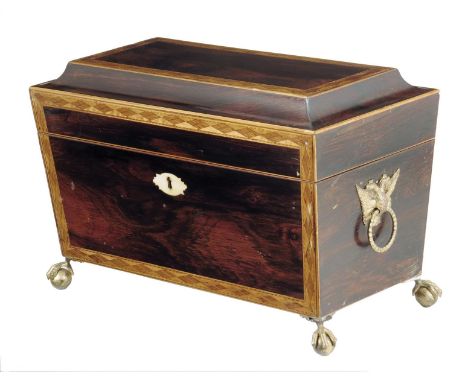 λ A Regency rosewood sarcophagus shape tea chest, inlaid with lozenge parquetry banding, the interior with a pair of pull-out