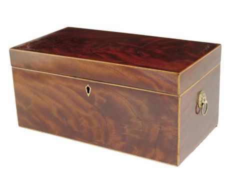 A late George III mahogany tea caddy, inlaid with boxwood stringing, the interior with five lidded compartments and a central