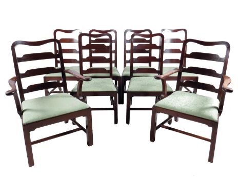 A set of eight George II mahogany dining chairs, each with a curved ladder back above a drop-in seat, on square supports unit