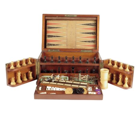 λ A late Victorian mahogany and brass bound games compendium, the lid inset with a folding leather chequer, backgammon and ho