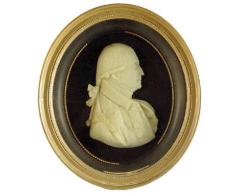 A large George III wax portrait relief bust of Dr Henry Revell Reynolds, in the manner of James Tassie, 23 x 16cm, mounted in