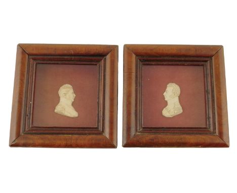 A pair of 19th century relief portrait busts of French officers, one in wax, each mounted in a glazed moulded walnut frame, 1