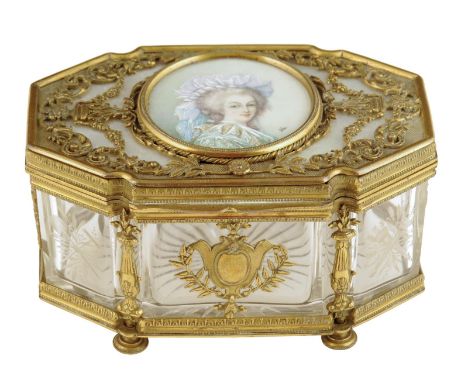 λ A French Louis XVI style gilt metal and glass casket, the hinged lid with a mother of pearl panel and an ivory portrait min