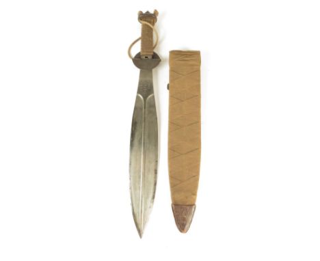 A Welsh Fusiliers trench fighting knife, the leaf shape blade with medial ridge and inscribed DROS URDDAS CYMRU with a rope b