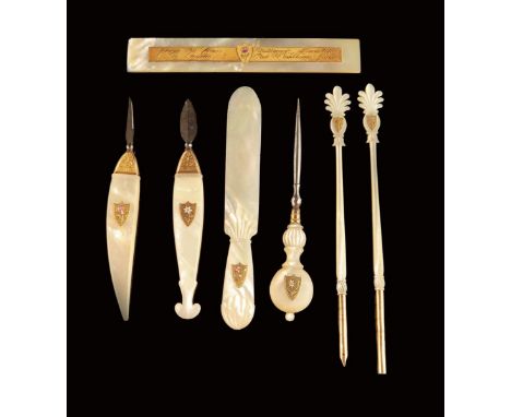 Seven early 19th century Palais Royal mother of pearl and gold utensils, each marked with an enamel pansy within a shield and