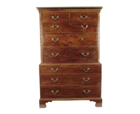 A George III mahogany secrétaire chest on chest, the Greek key moulded cornice above two short and three long drawers, the se