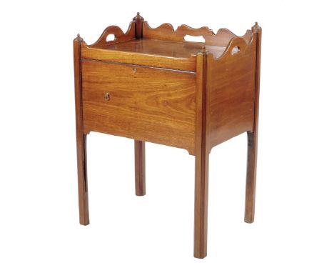 A George III mahogany tray-top bedside commode, the shaped gallery pierced with three handgrips, above a slide-down door, 75.