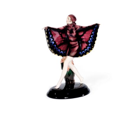 Josef Lorenzl (Austrian, 1892-1950) for Goldscheider'The Captured Bird': An Earthenware Figure of a Dancer with Butterfly Gos