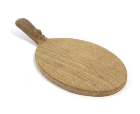 Workshop of Robert Mouseman Thompson (Kilburn): An English Oak Cheese Board, of shaped octagonal form, with carved mouse trad