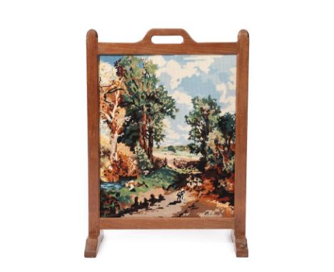 Workshop of Robert Mouseman Thompson (Kilburn): An English Oak Firescreen, with carrying aperture and octagonal finials, the 