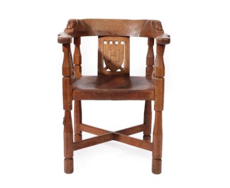 Robert Mouseman Thompson (1876-1955): An English Oak Monk's Chair, with curved back and shaped arms, each side carved with a 