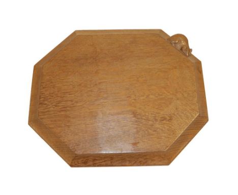 Workshop of Robert Mouseman Thompson (Kilburn): An English Oak Bread Board, of canted rectangular shape, with carved mouse tr