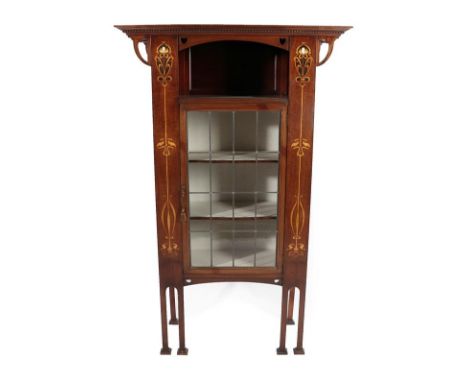 An Art Nouveau Leaded Glazed and Marquetry Inlaid Mahogany Display Cabinet, with an overhanging cornice above an enclosed ope