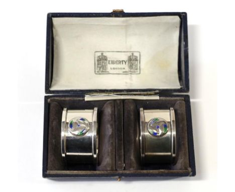 A Pair of Arts &amp; Crafts Silver and Enamel Napkin Rings, made by William Hair Haseler, with stylised roundels, maker's mar