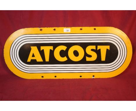 An enamel oval advertising sign for "Atcost", 30cm x 76cm