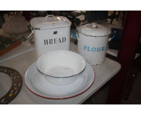 A vintage enamel bread bin; a flour bin; an enamel bowl and a large shallow dish