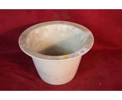 A white glazed china commode liner