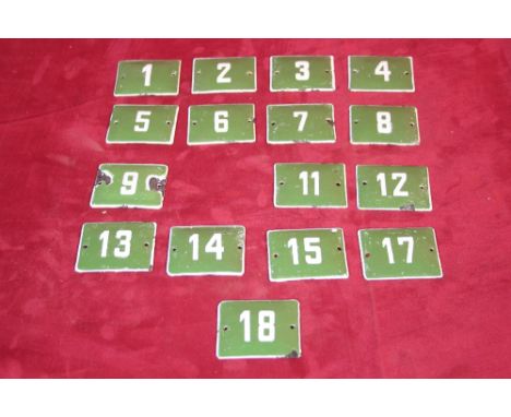 A collection of enamel numbers (No's. 1- 18, No.10 missing)