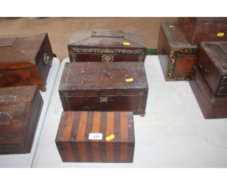 A Regency brass inlaid sarcophagus shaped tea caddy; another rectangular similar and an inlaid two compartment tea caddy (in 
