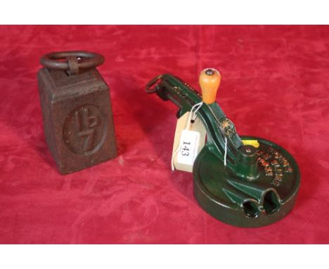A vintage bean slicer and a 7lb iron weight