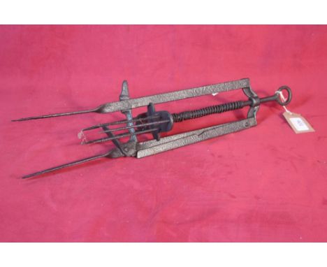 A vintage iron mechanical mole trap