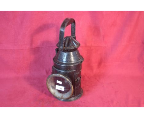 A vintage painted metal railway lamp