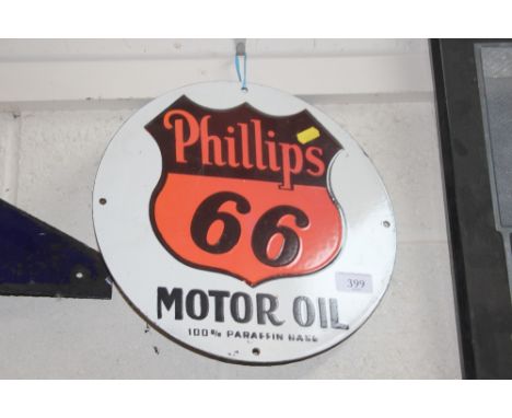 A circular enamel advertising sign for "Phillips 66 Motor Oil" 30.5cm diameter
