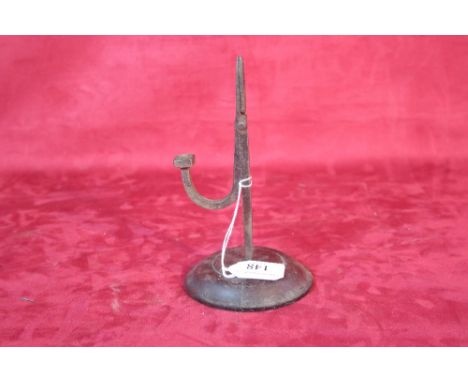 An early 18th Century iron rush light holder 
