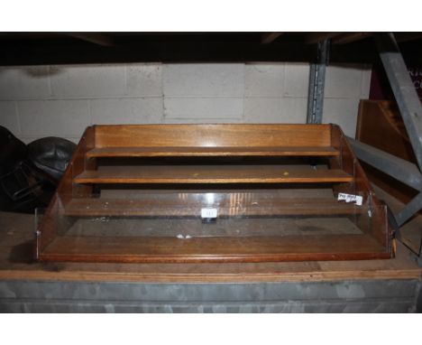 A vintage light oak shop display stand with chrome mounts, 92cm wide  