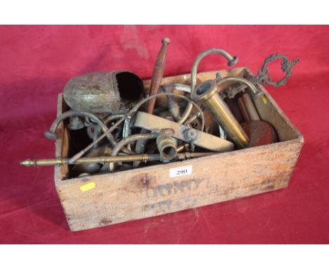 A vintage wooden box and contents of various brass and other metalware items to include coat hanger, candlesticks, Eastern br