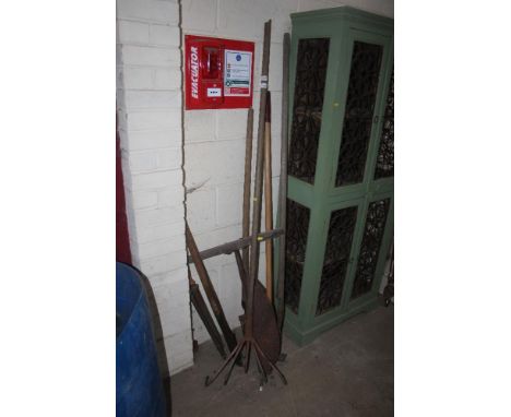 A collection of wooden handled tools to include rake, hay knife, hoe etc.