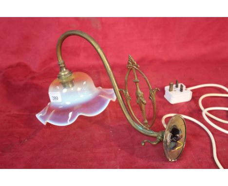 A late Victorian / Edwardian brass gas wall light (converted) with milky opaque glass shade