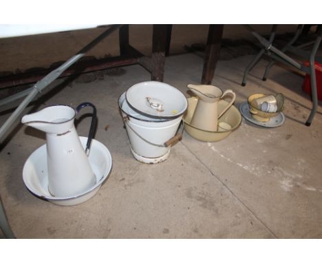 A quantity of enamel ware to include slops pail, jug and basin sets etc. 