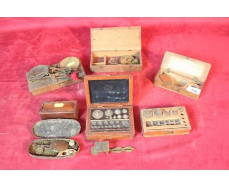 A collection of various 19th Century sovereign and other scales