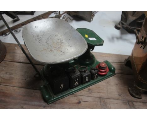 A set of cast iron kitchen scales and weights 