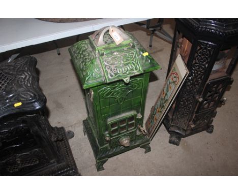 A Godin cast iron green enamel stove, 90cm high