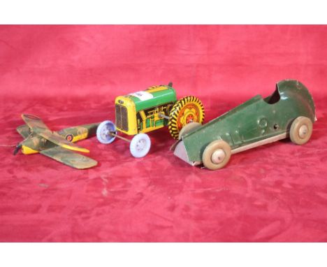 A Mettoy clockwork tin plate tractor; a tin plate clockwork vintage racing car and a wooden model of a bi-plane