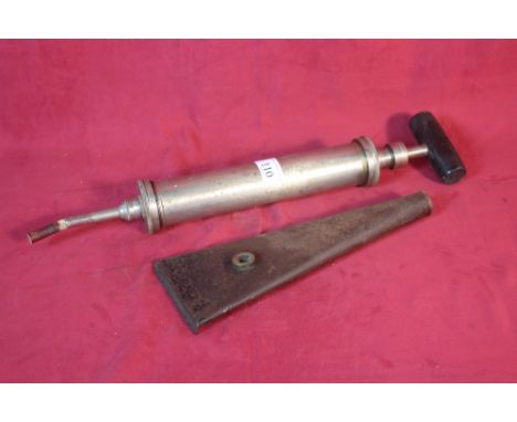 A vintage horse syringe with turned wooden handle and rubber tip; and a horse grooming singing tool 