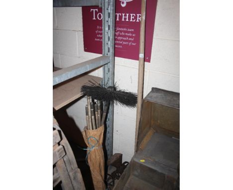A vintage metal seed drill; a long handled drainage scoop and a set of chimney sweep rods