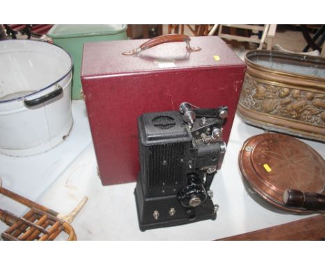 A vintage Specto Ltd. projector and box