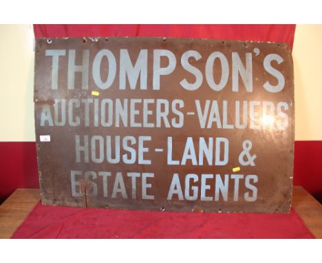 An enamel advertising sign for Thompson's Auctioneers and Valuers, 63cm x 90cm