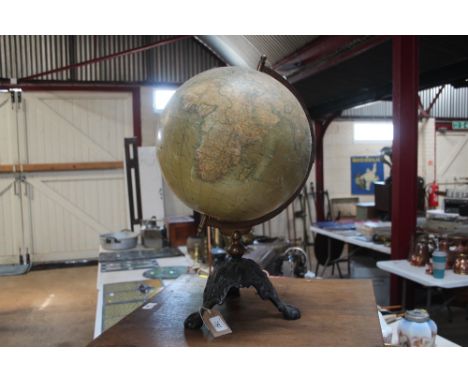 A Philips 12" readers globe on brass and cast iron stand 