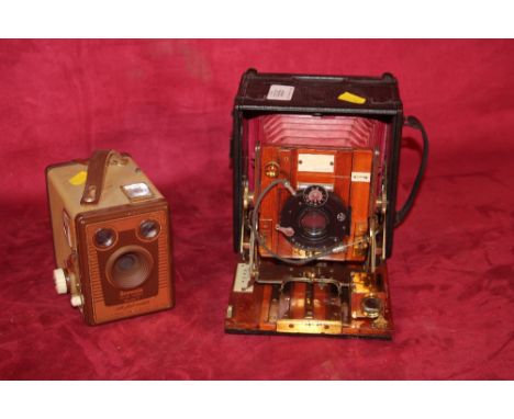 The Junior Sanderson C.P Goerz of Berlin camera; and a 620 Brownie model F-Kodak camera (brown)