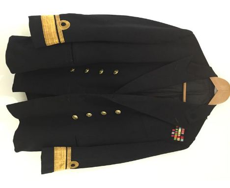 A POST SECOND WORLD WAR ADMIRALS JACKET, with medal bars and gilt buttons.